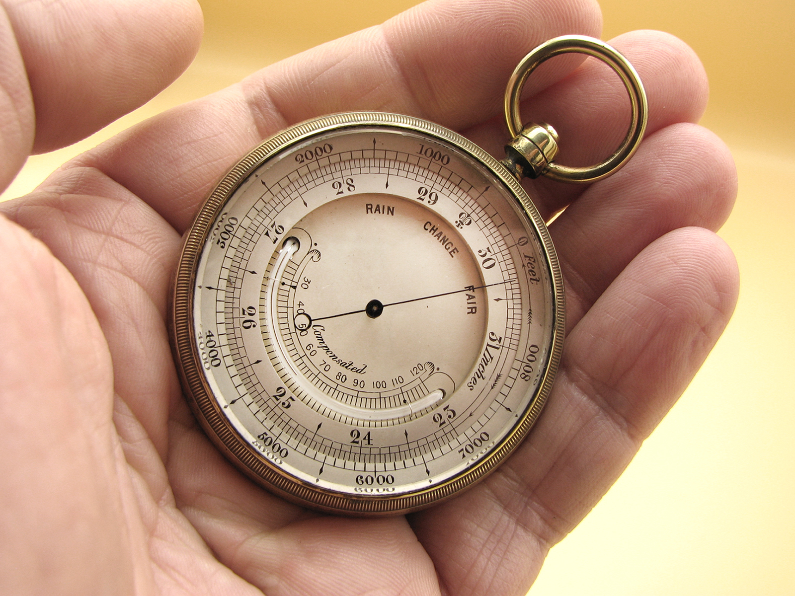 Late 19th century pocket barometer with curved thermometer in outer case